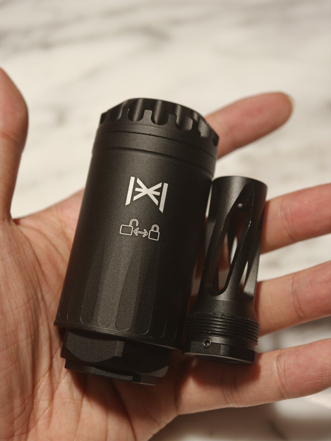 Compact HUXWRX Blastphemy airsoft blast can and threaded adapter